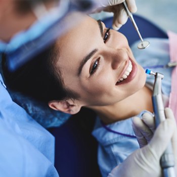 Dental patient having her teeth polished