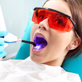 Patient receiving dental sealants