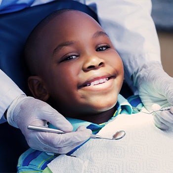 Smiling young boy in dental chair