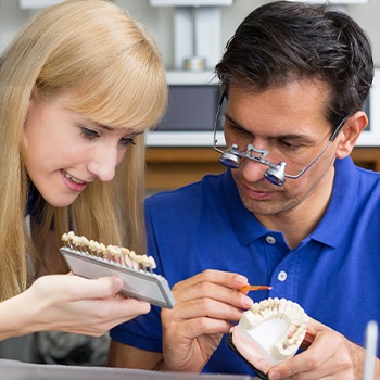 Dental lab team working on custom restoration