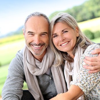 Smiling older man and woman outdoors