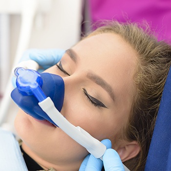 Woman with nitrous oxide nasal mask